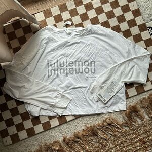 Lululemon size 12 NWT long sleeve crop shirt. White.